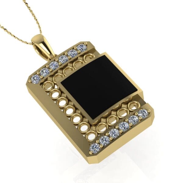 A gold necklace with a black and white pendant.