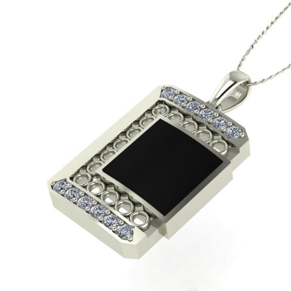 A silver necklace with a black and white pendant