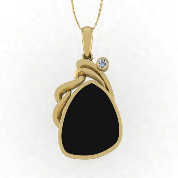 A gold necklace with a black stone and a diamond.