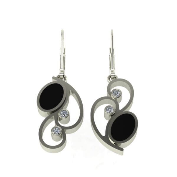 A pair of earrings with black and white stones.
