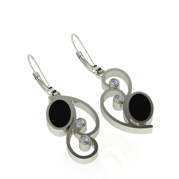 A pair of silver earrings with black stones.