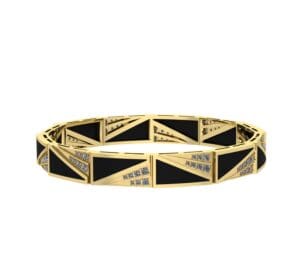 A gold bracelet with black and white diamonds.