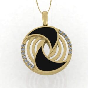 A gold necklace with black and white pendant