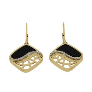 A pair of gold earrings with black and white stones.
