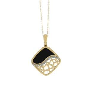 A gold necklace with a black and white pendant.